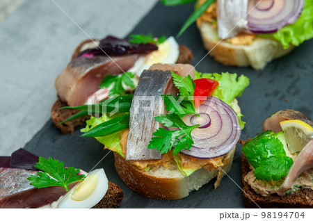 Appetizer with salted herring. Appetizer with salted herring. 98194704