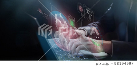 Working with NFT digital objects using a laptop 98194997