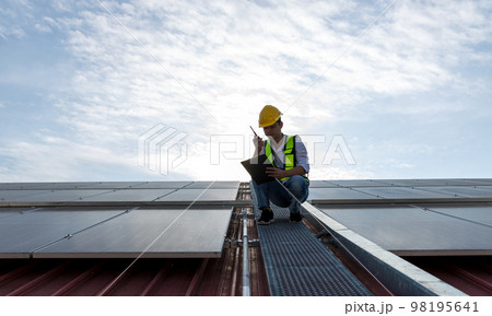 Engineer working setup Solar panel at the roof top. Engineer working setup Solar panel at the roof top. 98195641