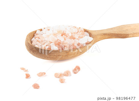 Large crystals of Himalayan pink salt in a wooden spoon and on a white background. Large crystals of Himalayan pink salt in a wooden spoon and on a white background. 98196477