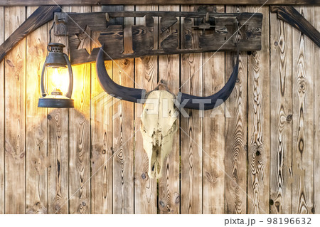 signboard with bull skull and kerosene lamp signboard with bull skull and kerosene lamp 98196632