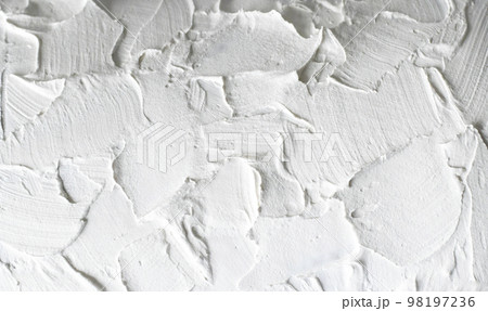 Macro photo of a white rough wall. Close-up of the putty 98197236
