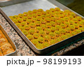 Famous Turkish sweets on a tray showcase market 98199193