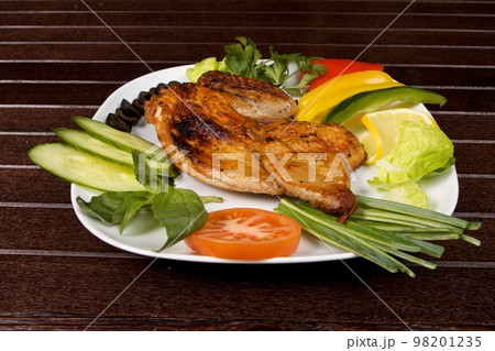 roast chicken in plate roast chicken in plate 98201235