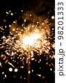 yellow sparkler with fire particles 98201333