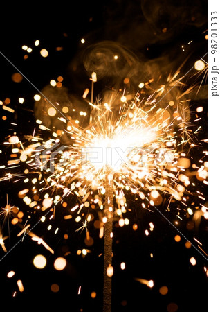 yellow sparkler with fire particles yellow sparkler with fire particles 98201333