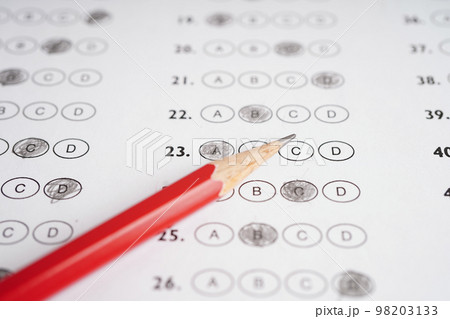 Answer sheets with pencil drawing fill to select choice, education concept. 98203133