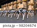 Robotic delivery dog in a factory, Concept Robot dog delivering goods. 98204674