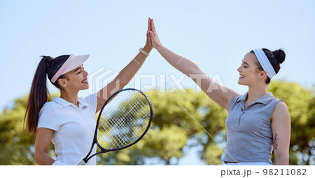 Sports, team high five and tennis friends happy after game win, competition goals or celebrate fitness partnership success. Support, winner and teamwork celebration for exercise, workout or training Sports, team high five and tennis friends happy after game win, competition goals or celebrate fitness partnership success. Support, winner and teamwork celebration for exercise, workout or training 98211082