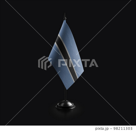 Small national flag of the Botswana on a black background 98211303