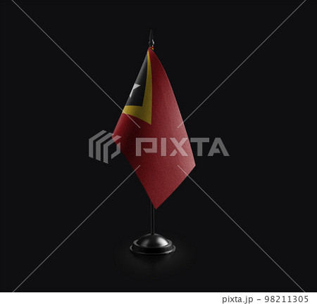 Small national flag of the East Timor on a black background 98211305