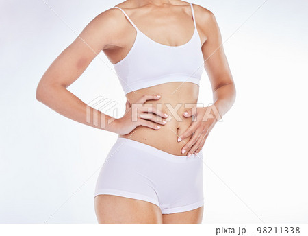 Woman, stomach and slim body, wellness and healthy lifestyle, skincare and fitness on studio background. Closeup model in underwear, beauty and weightloss, diet and nutrition, abdomen and liposuction Woman, stomach and slim body, wellness and healthy lifestyle, skincare and fitness on studio background. Closeup model in underwear, beauty and weightloss, diet and nutrition, abdomen and liposuction 98211338