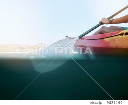 Lake, water sport and woman on kayak summer adventure, travel or trip canoeing, kayaking and using paddle on calm sea. Exercise, vacation or holiday with female enjoying healthy boat activity 98211904