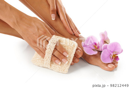 Spa, scrub and woman with cosmetics, feet and natural beauty for lady isolated on white studio background. Lady, flower and foot with skincare, cleaning and dermatology for luxury pedicure treatment 98212449