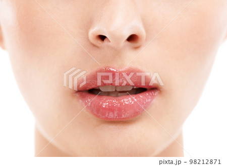 Woman face, skincare or lips with makeup cosmetics, mouth dermatology or healthcare wellness on white background. Zoom, beauty model and macro of facial lip gloss product for collagen hydration glow Woman face, skincare or lips with makeup cosmetics, mouth dermatology or healthcare wellness on white background. Zoom, beauty model and macro of facial lip gloss product for collagen hydration glow 98212871