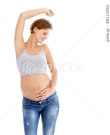 Body of happy pregnant woman in studio dance on white background for pregnancy health, growth and development. Healthcare, wellness and an excited mother, hand holding stomach with advertising space Body of happy pregnant woman in studio dance on white background for pregnancy health, growth and development. Healthcare, wellness and an excited mother, hand holding stomach with advertising space 98213002