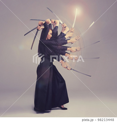 Woman, warrior nun and sword in martial arts with motion blur strike against a studio background. Female wielding a sharp samurai blade, weapon or ninja fighter attacking in black cosplay Woman, warrior nun and sword in martial arts with motion blur strike against a studio background. Female wielding a sharp samurai blade, weapon or ninja fighter attacking in black cosplay 98213448