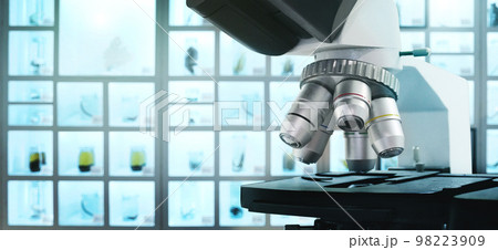 Microscope for science lab or research to expand view on the background 98223909