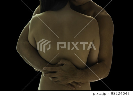 Young naked couple are embrace to each other together isolated on black background with clipping path. 98224042