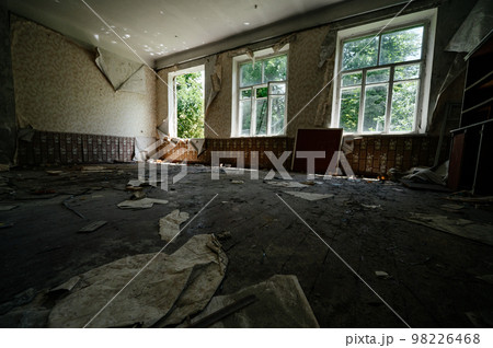 Abandoned old classroom with blue painted walls, dark horrible and dirty classroom. Abandoned old classroom with blue painted walls, dark horrible and dirty classroom. 98226468