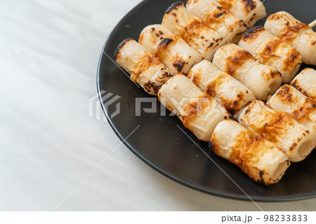 grilled tube shaped fish paste cake skewe or tube squid skewer 98233833