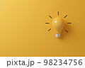 Light bulb yellow on yellow background 98234756