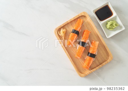 Crab Stick Sushi on wood plate 98235362