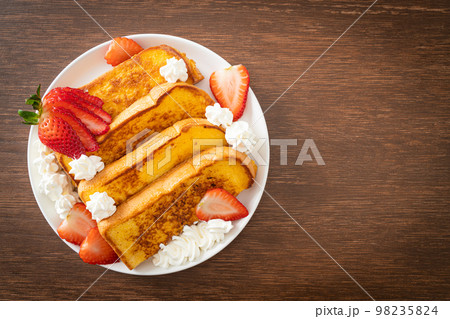 french toast with fresh strawberry and whipping cream 98235824