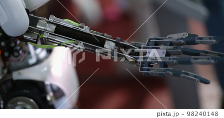 Future technology in black prosthetic hand closeup 98240148