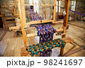 Handmade wooden loom to create national silk trani in Bukhara in Uzbekistan. 05.05.2019 98241697