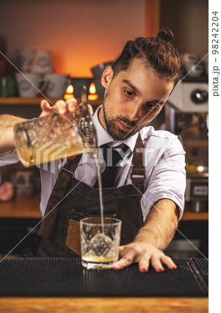 Bartender making cocktail 98242204