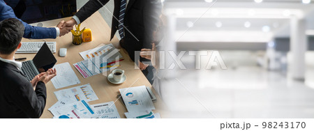 Group business people handshake at meeting table in widen view 98243170