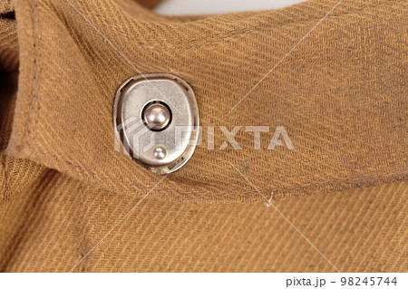 A fragment with a rivet from an old duffel. A fragment with a rivet from an old duffel. 98245744