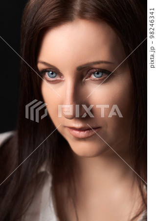 Portrait of Caucasian ethnicity adult woman forty years old. Beautiful female human face of brunette with gray eyes. Soft selective focus, deep-of-field of eyes. 98246341