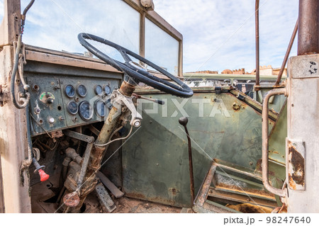Abandoned and rusty military vehicles in the middle of the desert Abandoned and rusty military vehicles in the middle of the desert 98247640