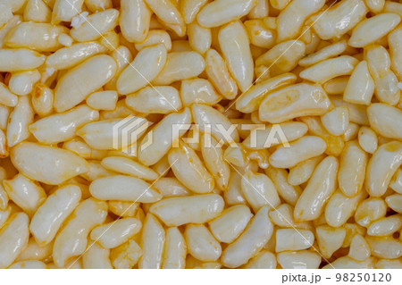Close up: puffed honey rice - macro, top view 98250120