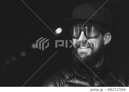 Young man with sports glasses in white and black Young man with sports glasses in white and black 98252566