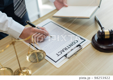 Law consultancy concept A male lawyer making clear of some details by adding clearer description on the contract by himself. Law consultancy concept A male lawyer making clear of some details by adding clearer description on the contract by himself. 98253922