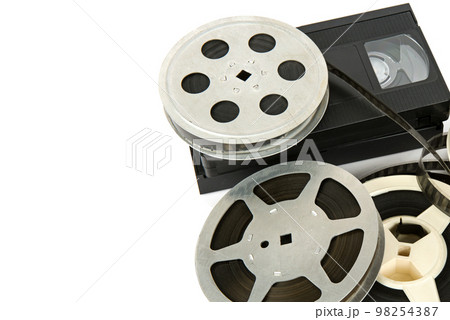 Film reel and videocassette isolated on white background. Free space for text. 98254387