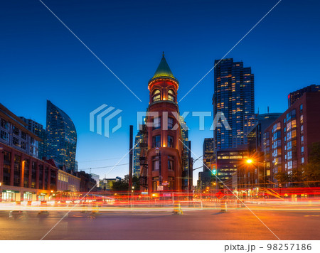 Canada, Toronto. The famous Gooderham building and the skyscrapers in background. Canada, Toronto Canada, Toronto. The famous Gooderham building and the skyscrapers in background. Canada, Toronto 98257186