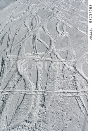 deep trace from ski and snowboard on snow winter mountain slope, freeride deep trace from ski and snowboard on snow winter mountain slope, freeride 98257568