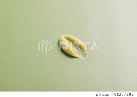 Beauty product, face body scrub cream mask, smear sample. Natural cosmetics texture green background 98257895