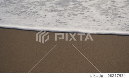 Where the land meets the sea, sea foam sand in low sun conditions Where the land meets the sea, sea foam sand in low sun conditions 98257924
