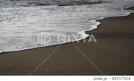 Where the land meets the sea, sea foam sand in low sun conditions Where the land meets the sea, sea foam sand in low sun conditions 98257926