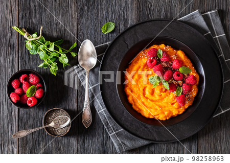 Sweet Potato Mash topped with fresh Raspberries 98258963