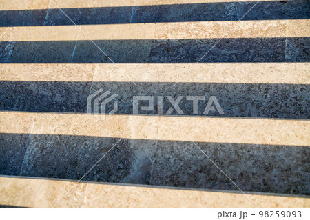 Staircase in the city, black and white pattern on the stairs on a sunny day. 98259093