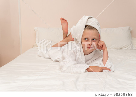 Smiling thinks elbows Creek coffee smile copyspace bathrobe white hygiene, concept morning lifestyle from bath and beautiful caucasian, little background. Bathing kid female, Smiling thinks elbows Creek coffee smile copyspace bathrobe white hygiene, concept morning lifestyle from bath and beautiful caucasian, little background. Bathing kid female, 98259368