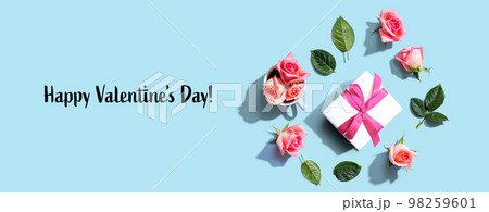 Valentines Day message with a gift box and roses Valentines Day message with a gift box and roses 98259601