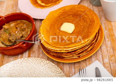 Belarusian machanka with assorted meat served with pancakes 98261665