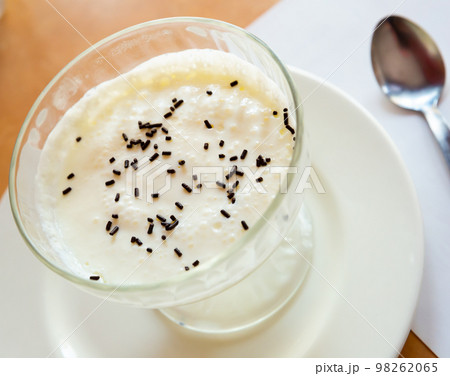 Image of tasty creamy mousse served at plate with spoon 98262065